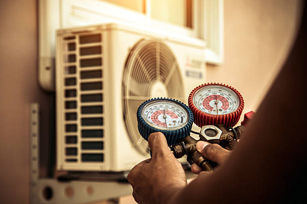 Professional Air Conditioning Service technician working in Mechanicsburg, IL